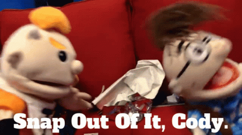 Two Puppets on Red Couch With Snap Out of It Cody