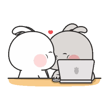 Two Rabbits Kissing in Front of Laptop