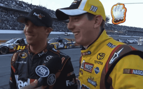 Two Race Car Drivers Talking Number 18 Cap
