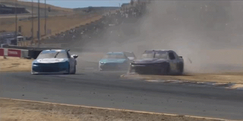 two race cars are going down a track and one has the number 1 on the front of it