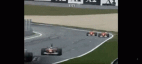 Two Race Cars Racing on Track