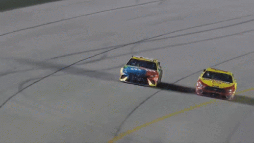 Two Race Cars Racing With Coca Cola Sticker