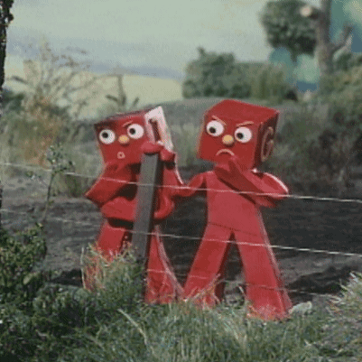 Two Red Figures Standing Next To Each Other