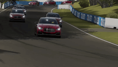 Two Red Infiniti Cars Are Driving On A Track GIF