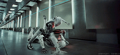 Two Robots Are Fighting In A Hallway With The Words Arkvgifs Tumblr Visible GIF
