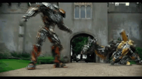 Two Robots Standing in Front of Building