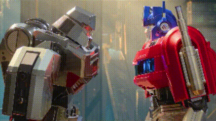 Two Robots Standing Next to Each Other One Is a Transformer
