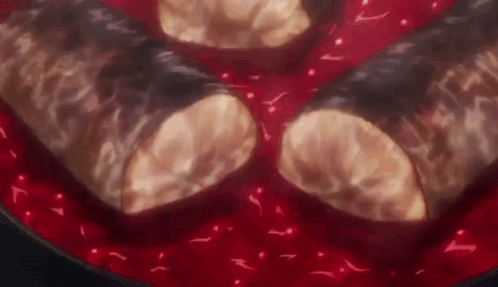 Two Sausages Cooking In Red Sauce GIF