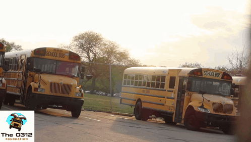 Two School Buses With Foundation Logo