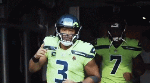 Two Seahawks Players Number 3 And 7 Are Running Out Of The Tunnel GIF