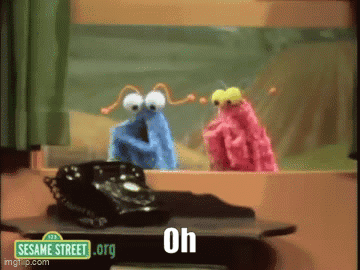 Two Sesame Street Characters Are Looking Out A Window With A Phone On A Table GIF