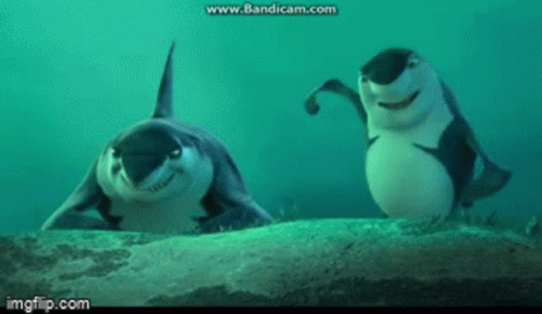Two Sharks Are Standing Next To Each Other In The Ocean And Smiling . GIF