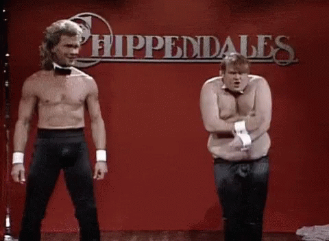 Two Shirtless Men Are Dancing On A Stage In Front Of A Sign That Says Hippendales . GIF