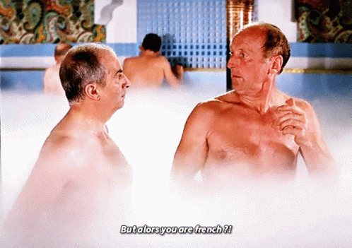 two shirtless men are talking in a bathtub with the caption but alors you are french ?