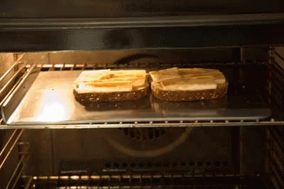 Two Slices of Bread Toasting in Oven
