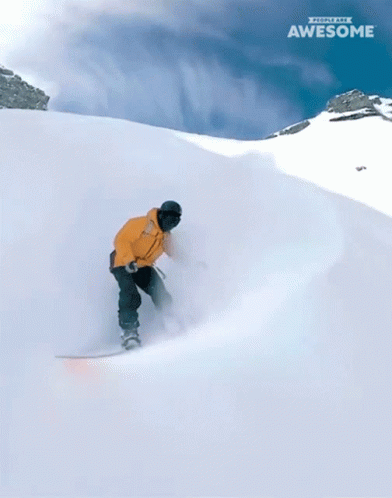 Two Snowboarders Are Going Down A Snow Covered Slope And The Word Awesome Is On The Bottom Right GIF