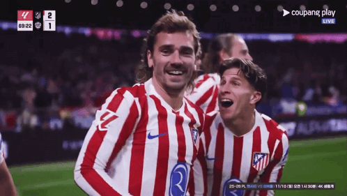 Two Soccer Players Are Celebrating A Goal During A Game Sponsored By Coupang GIF