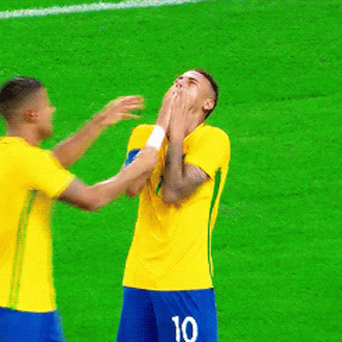Two Soccer Players Are Hugging And One Has The Name Rafael On The Back Of His Jersey GIF