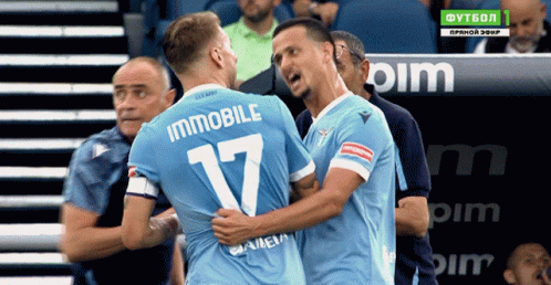 Two Soccer Players Are Hugging And One Has The Number 17 On His Back GIF