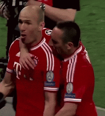 two soccer players are hugging each other and one has the number 6 on his shirt
