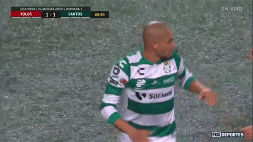 Two Soccer Players Are Hugging Each Other On A Field With Fox Deportes In The Upper Left Corner GIF