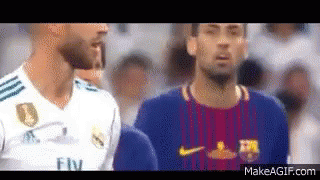 Two Soccer Players Are Standing Next To Each Other In A Crowd . GIF