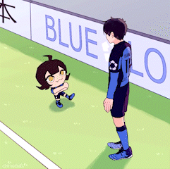 Two Soccer Players Beside Banner Saying Blue Lo