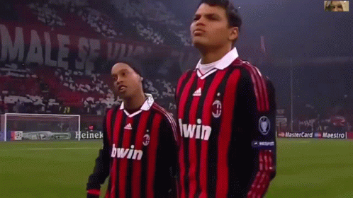 Two Soccer Players Bwin Shirts