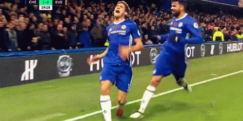 Two Soccer Players Celebrating Goal