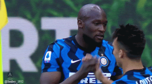 Two Soccer Players High Fiving