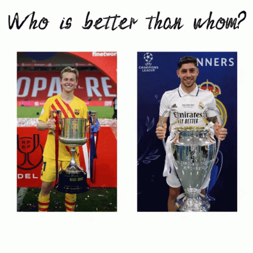 Two Soccer Players Holding Trophies