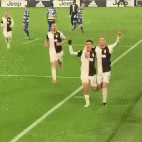 Two Soccer Players Hugging