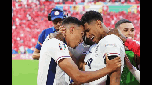 Two Soccer Players Hugging