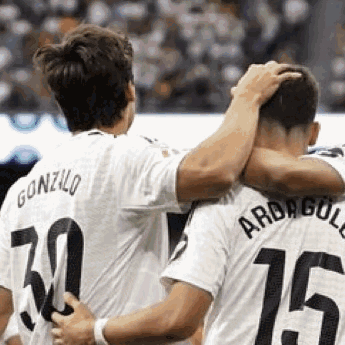 Two Soccer Players Hugging Number 15 GIF