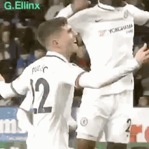 Two Soccer Players Hugging On Field GIF