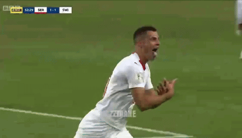Two Soccer Players in Emirates Fly Better Jerseys Talking to Referee