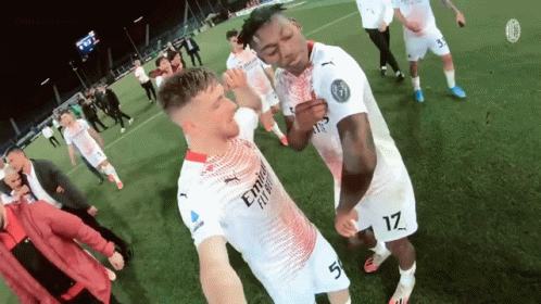 Two Soccer Players in Emirates Fly Jerseys