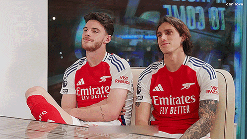 Two Soccer Players In Emirates Jerseys GIF