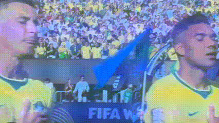 Two Soccer Players in Front of FIFA Sign