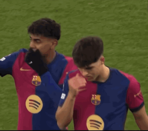 Two Soccer Players in Nike Jerseys on Field