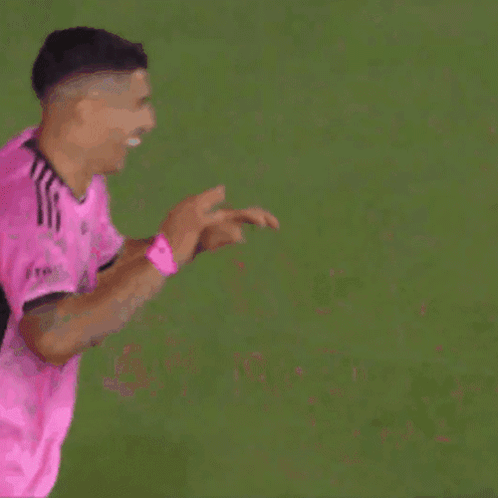Two Soccer Players In Pink Jerseys High Five GIF