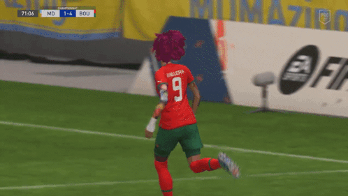 Two Soccer Players in Red and Green Uniforms Number 9