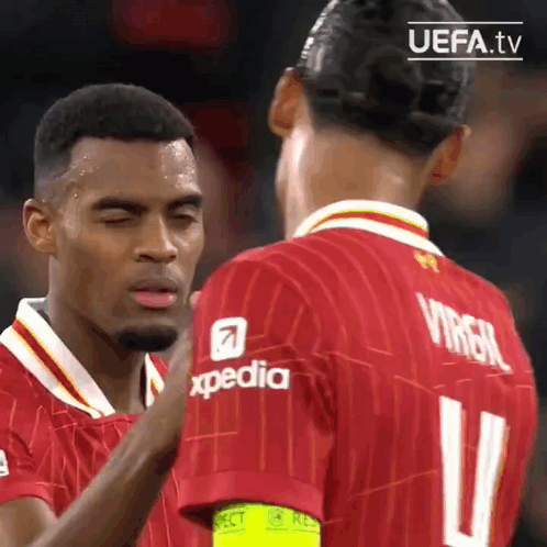 Two Soccer Players in Red Jerseys