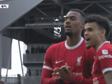 Two Soccer Players in Red Jerseys