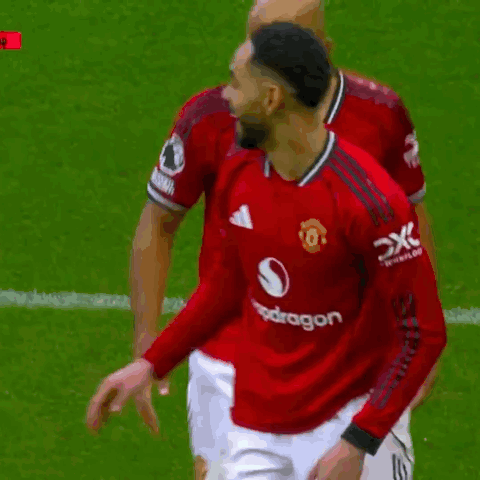 Two Soccer Players In Red Jerseys GIF