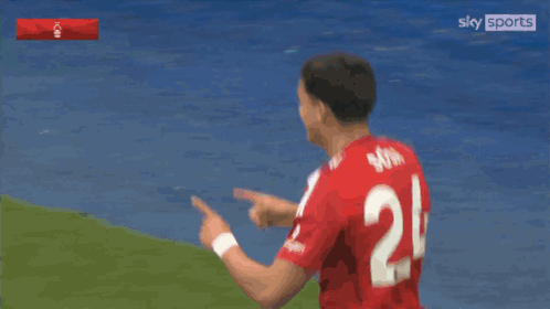 Two Soccer Players in Red Jerseys Number 7 and 24