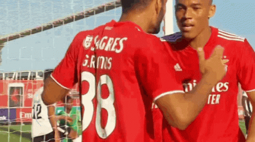 Two Soccer Players in Red Shirts Number 38