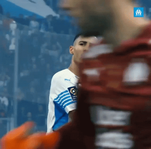 Two Soccer Players in White Blue and Red Jerseys