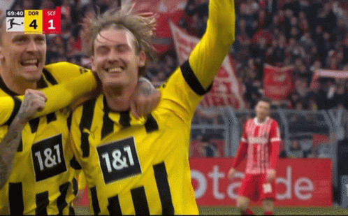 Two Soccer Players in Yellow and Black Jerseys 1 & 1