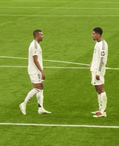 Two Soccer Players Number 9